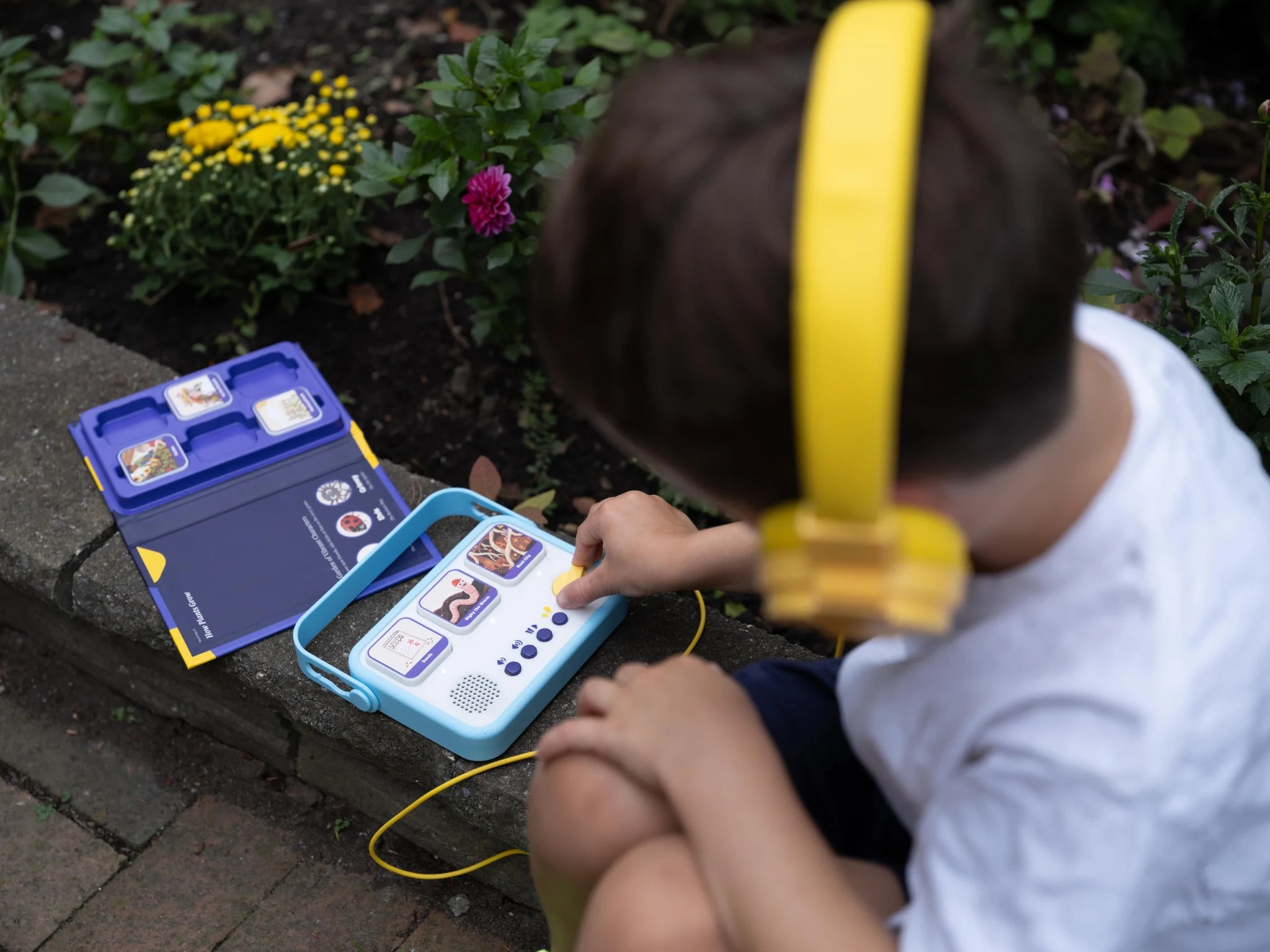 A child listening to their own story with headphones