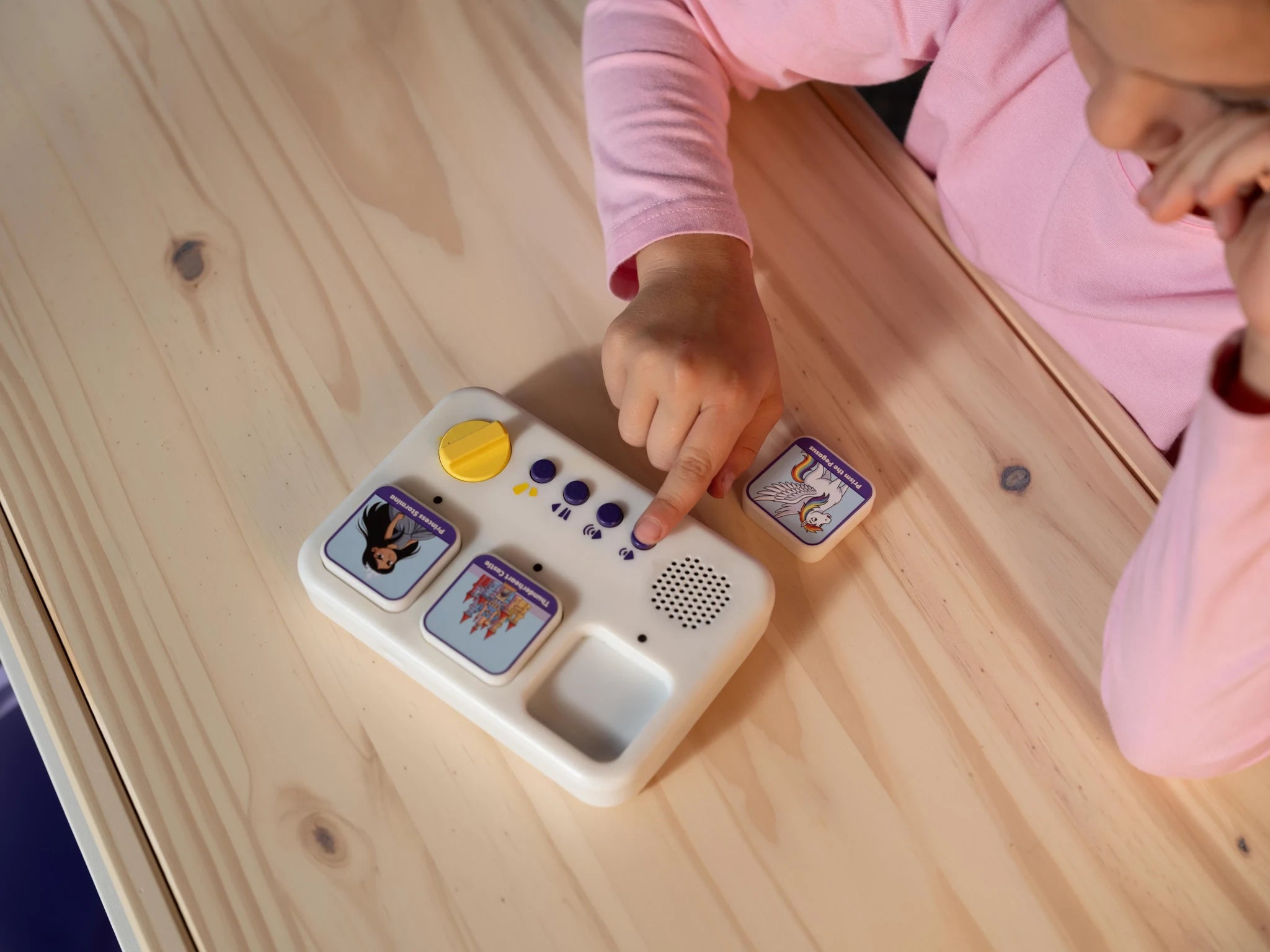 A child choosing story blocks on the storymaker