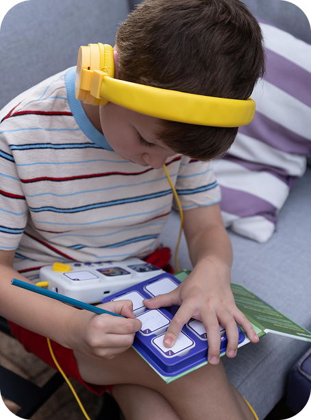 A child making stories with yellow headphones